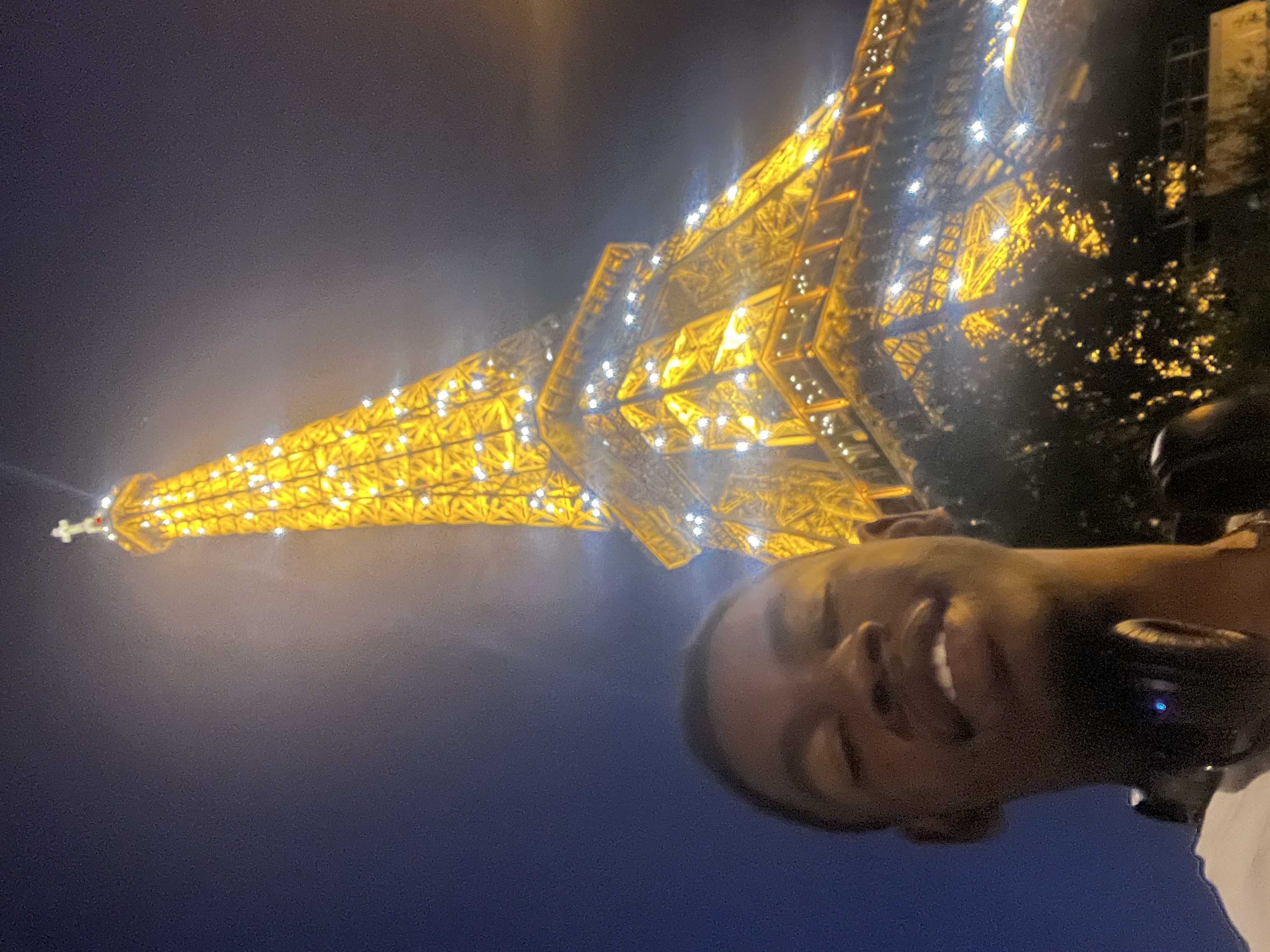Nick in Paris next to the Eiffel Tower
