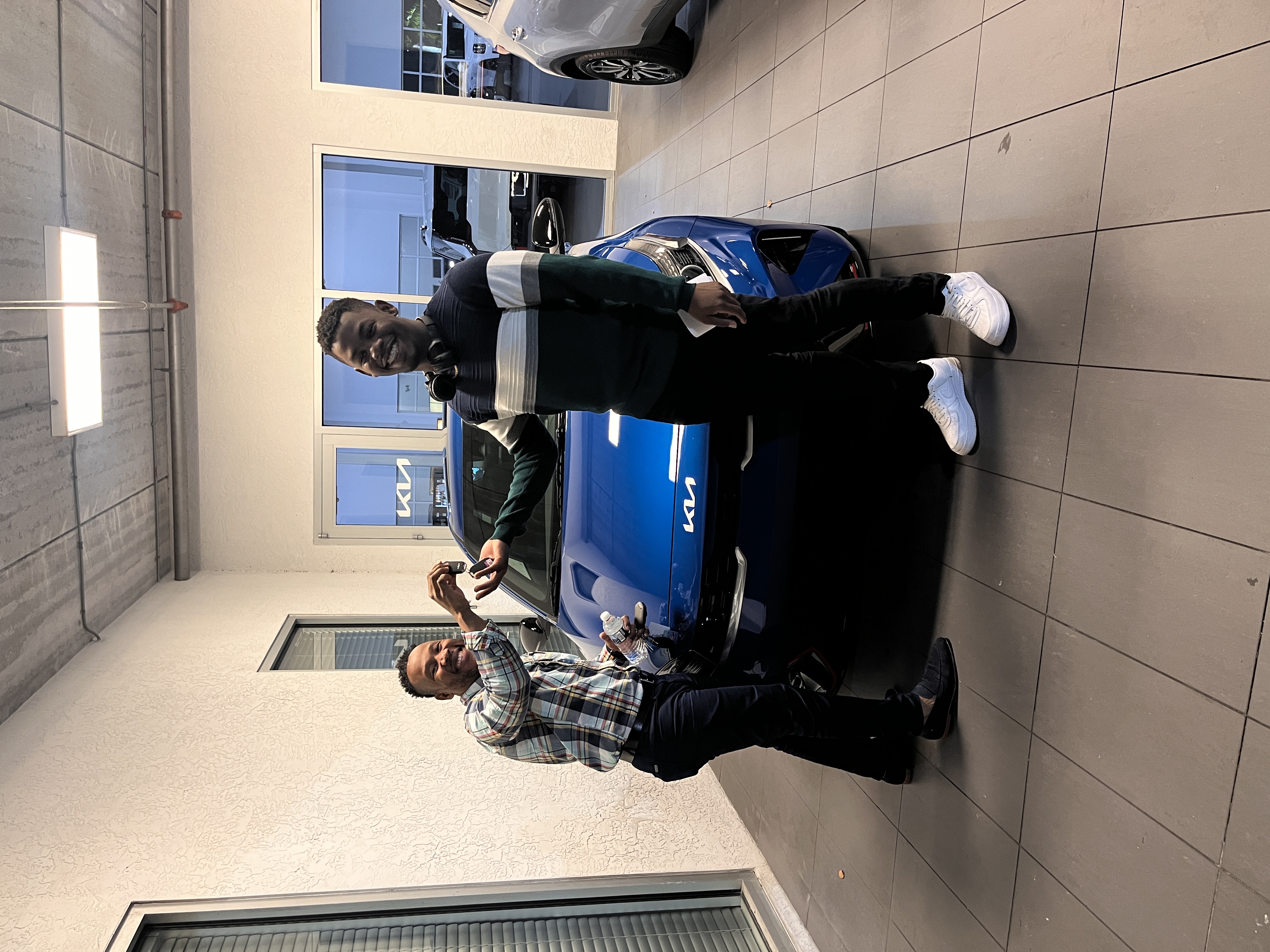 Dad handing Nick the keys to a new car