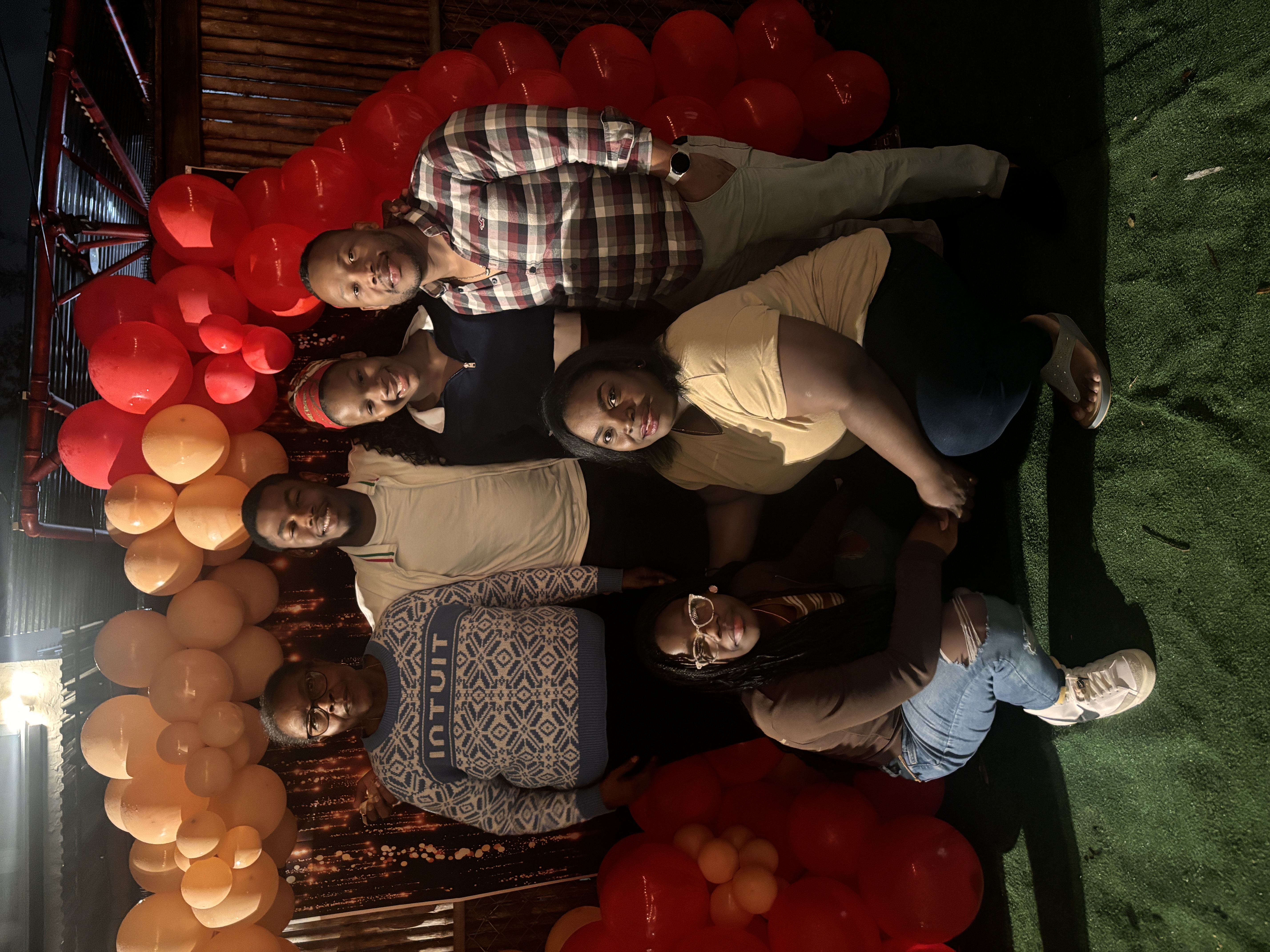 Nick and his dad doing a hanging bar challenge
